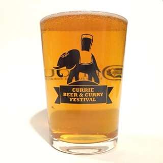 A view of a full pint glass with the Currie Beer & Curry Festival logo